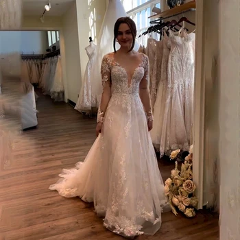 Sexy Profundo decote em V Vestidos de Casamento do Laço com a Ilusão de Mangas compridas Elegantes Apliques de Uma linha de Vestidos de Noiva de Tule Plissado 2023